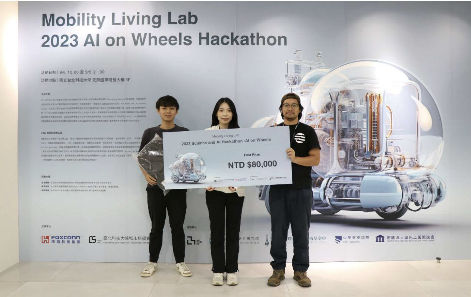 The team with the first-prize check at the 2023 AI on Wheels Hackathon